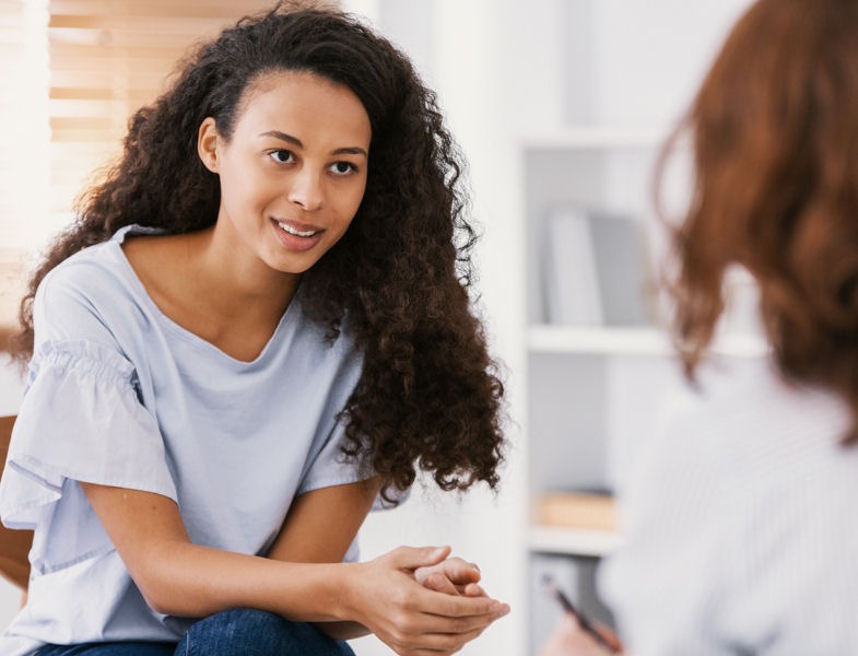 teen talking to health expert regarding insurance