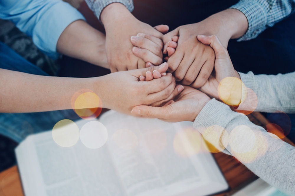 group holding hands