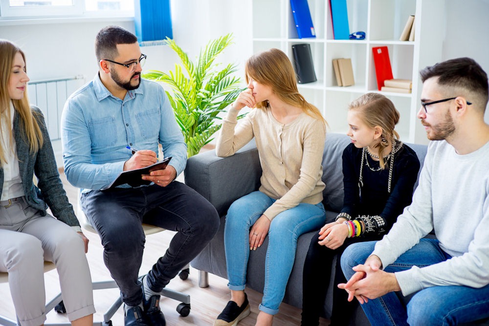 family therapy session with parents and two daughters