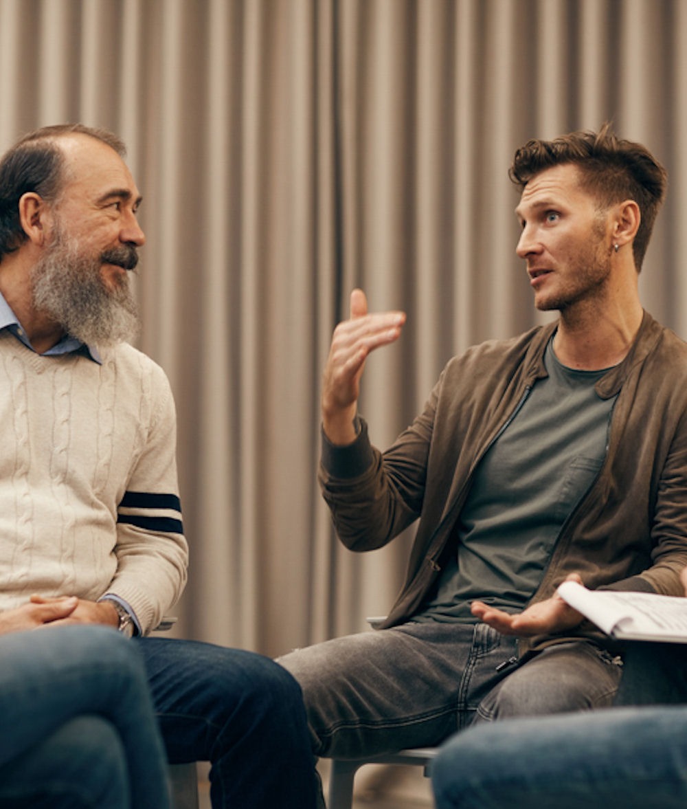 man sharing addiction experience in group session